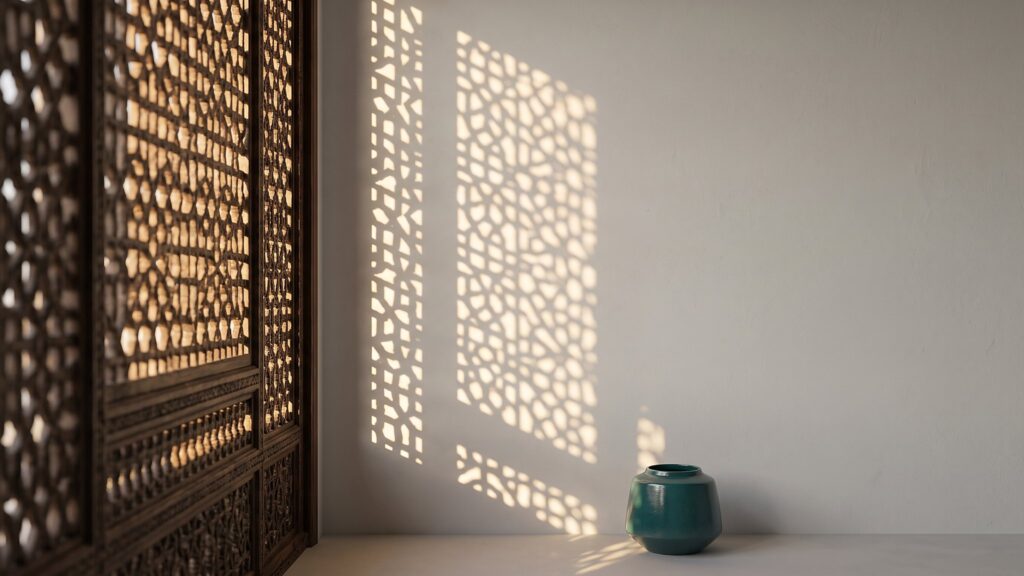 Sunlight through a carved wooden lattice screen casting patterns on a plaster wall